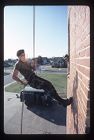 Army ROTC Cadets repelling down a wall